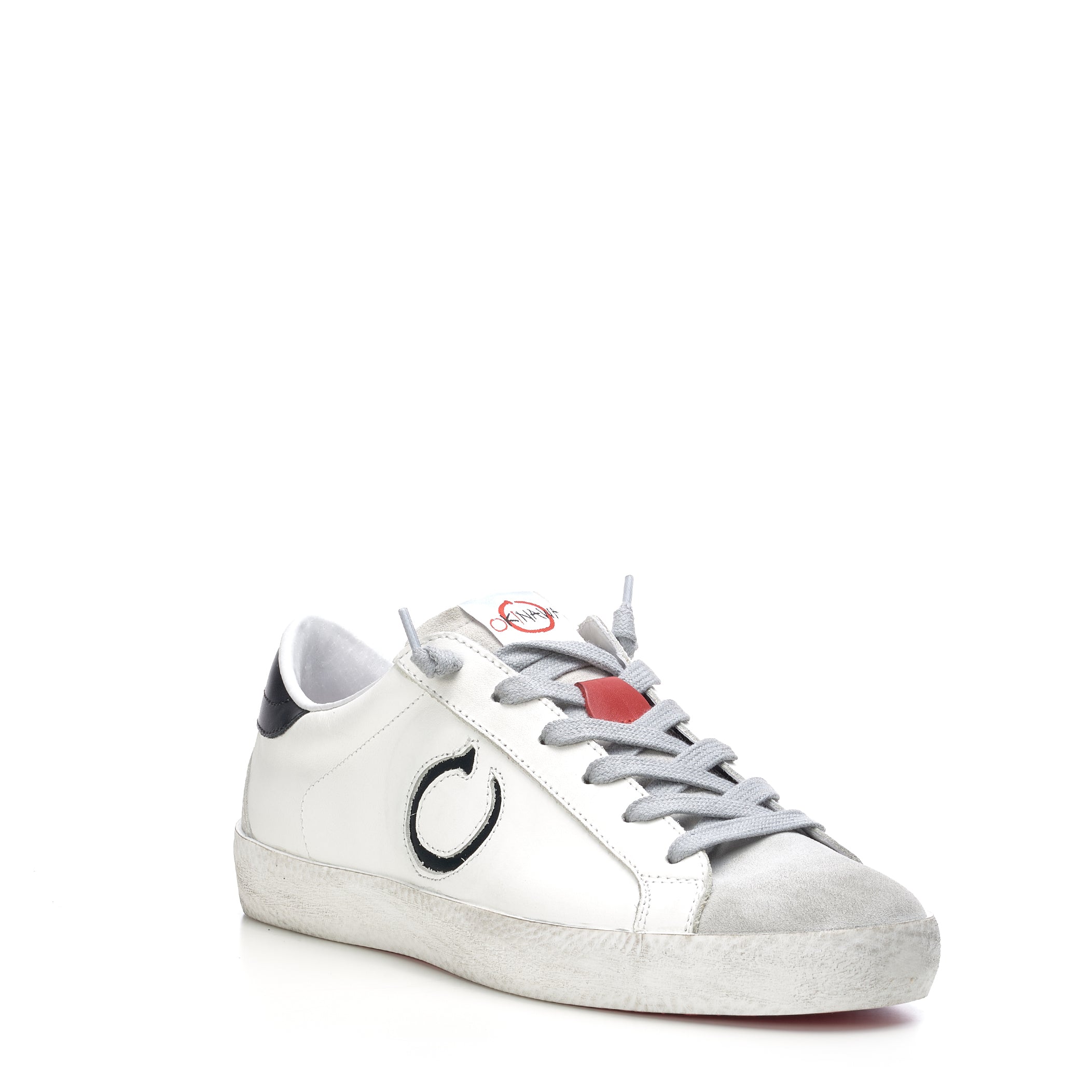 White sneakers with black logo